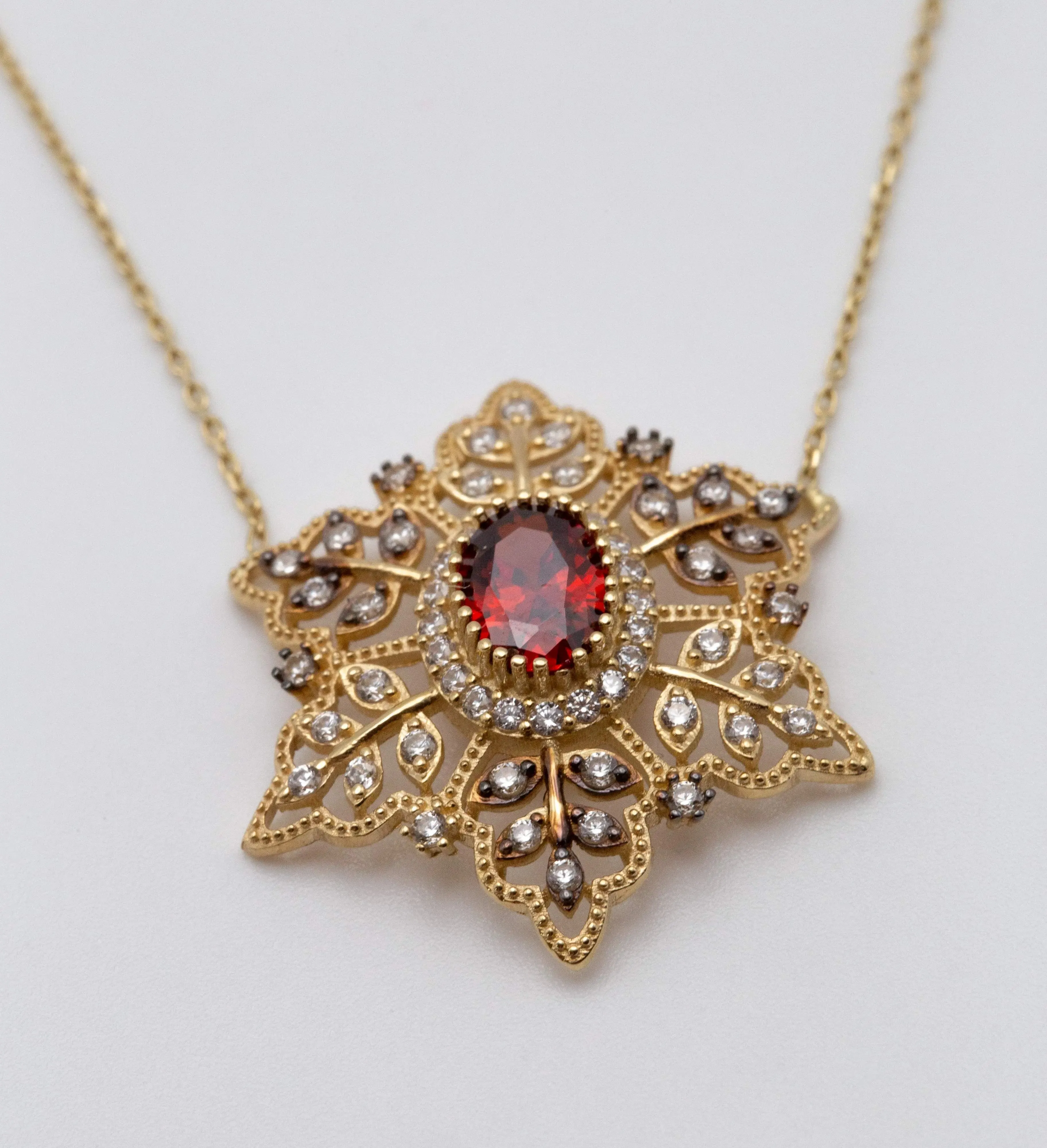 14K Yellow Gold Red Stoned Snowflake Necklace